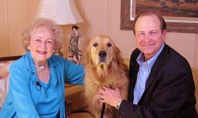 Doctor Jim Humphries with Betty White and a Golden Retriever
